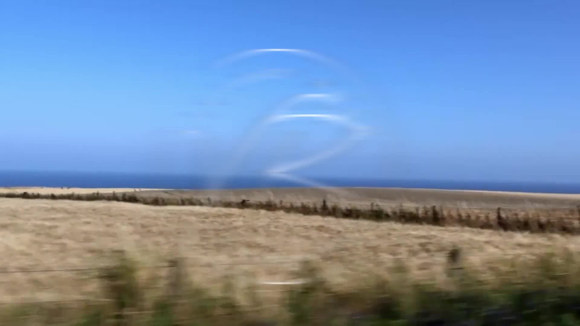Still from the Victory Road Collectables brand film — coastal fields